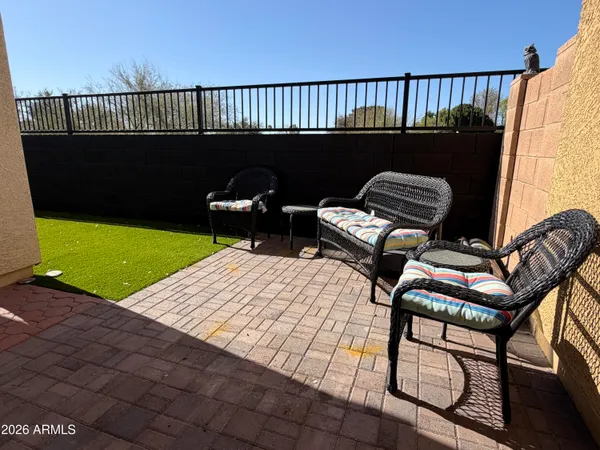 a view of balcony with wooden floor and outdoor seating