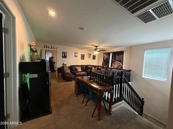 a view of a livingroom with furniture and window