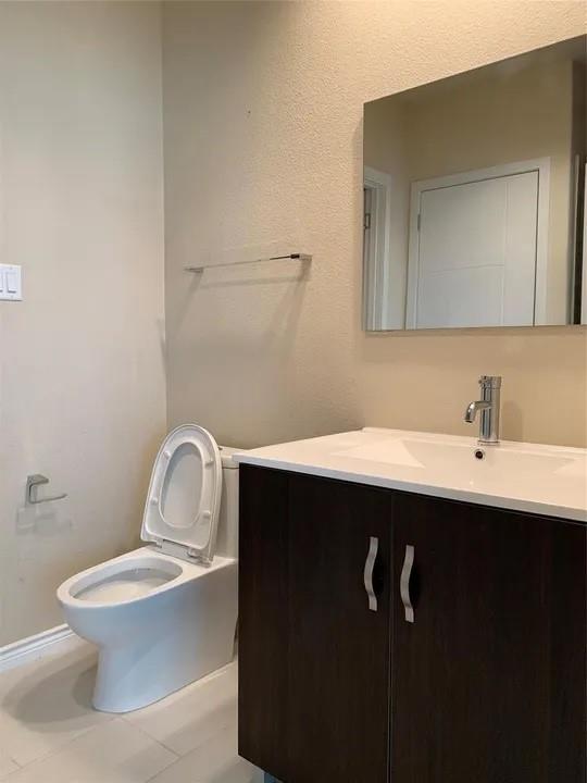 1100 West Trinity Mills Road Carrollton, TX 75006 - Photo 20 of 30 a bathroom with a sink and a toilet
