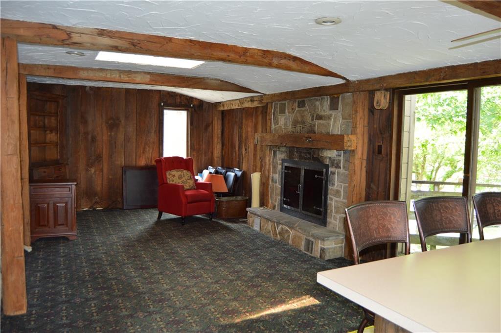 1098 Burtner Road Natrona Heights, PA 15065 - Photo 8 of 25 a living room with furniture window and a fireplace