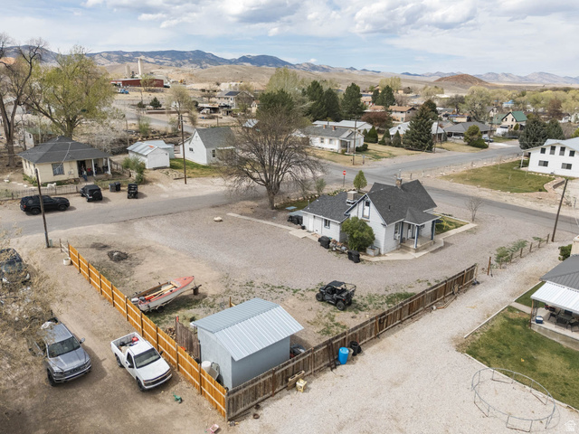 197 West 100 South Redmond, UT 84652 - Photo 34 of 41 Aerial perspective of suburban area featuring a mountain backdrop