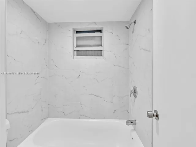 a bathroom with a bathtub