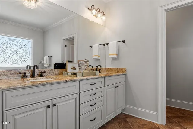a bathroom with a granite countertop sink mirror and