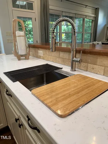 a bathroom with a bathtub and window