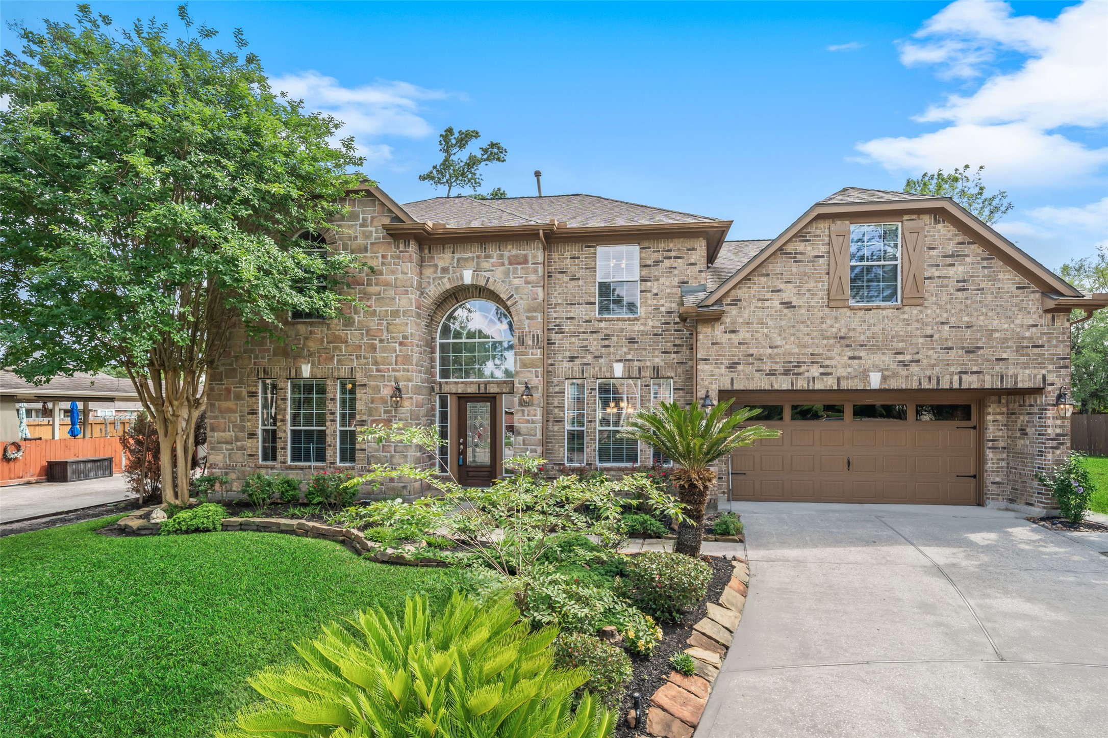 6407 Ashley Manor Drive Spring, TX 77389 - Photo 41 of 41 a front view of a house with garden