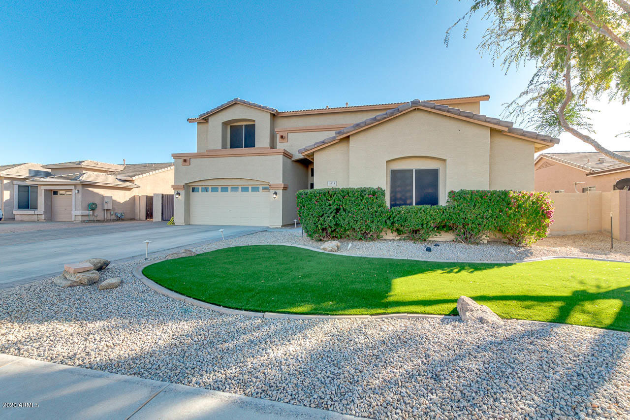 3315 East Los Altos Road Gilbert, AZ 85297 - Photo 3 of 66 a view of a big house with a yard and potted plants
