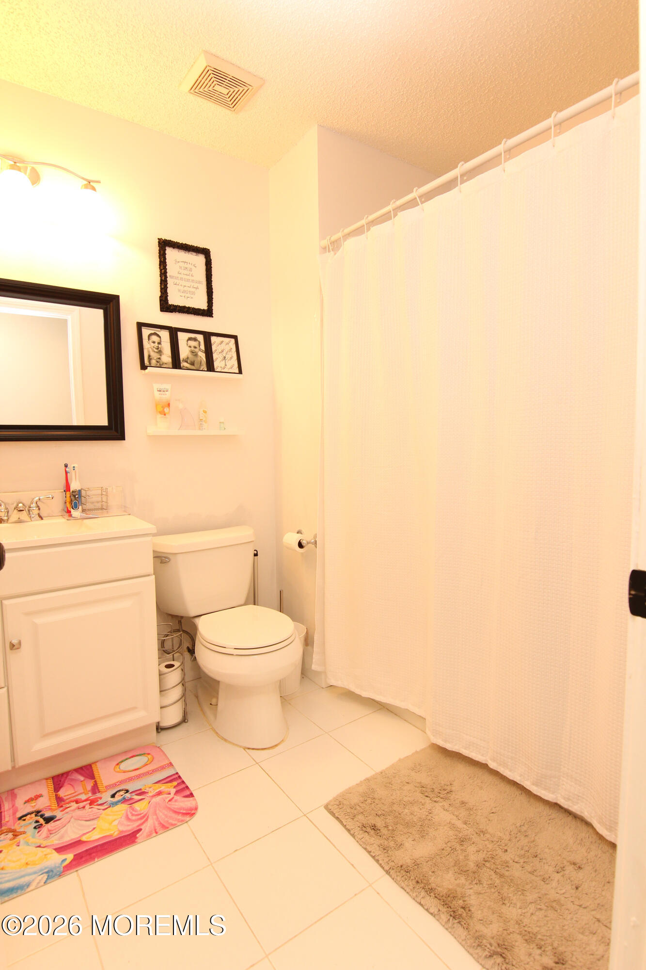 33 Austin Street Tinton Falls, NJ 07712 - Photo 17 of 46 a bathroom with a toilet a sink and a mirror