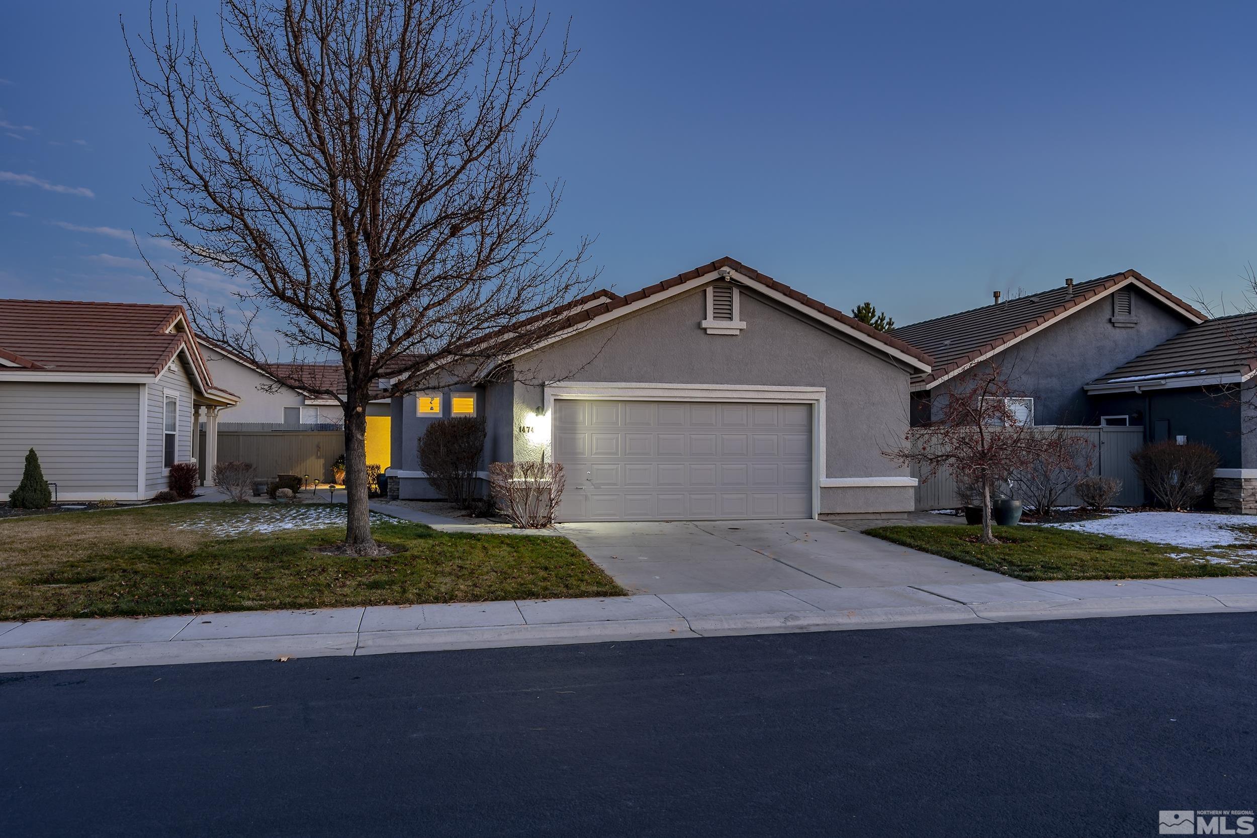 1474 Diamond Country Drive Reno, NV 89521 - Photo 1 of 38 a front view of a house with garden