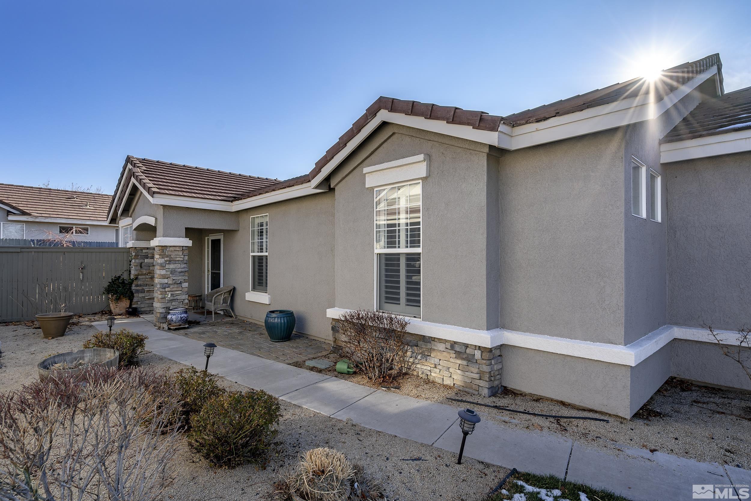 1474 Diamond Country Drive Reno, NV 89521 - Photo 36 of 38 a view of house with backyard outdoor seating and barbeque