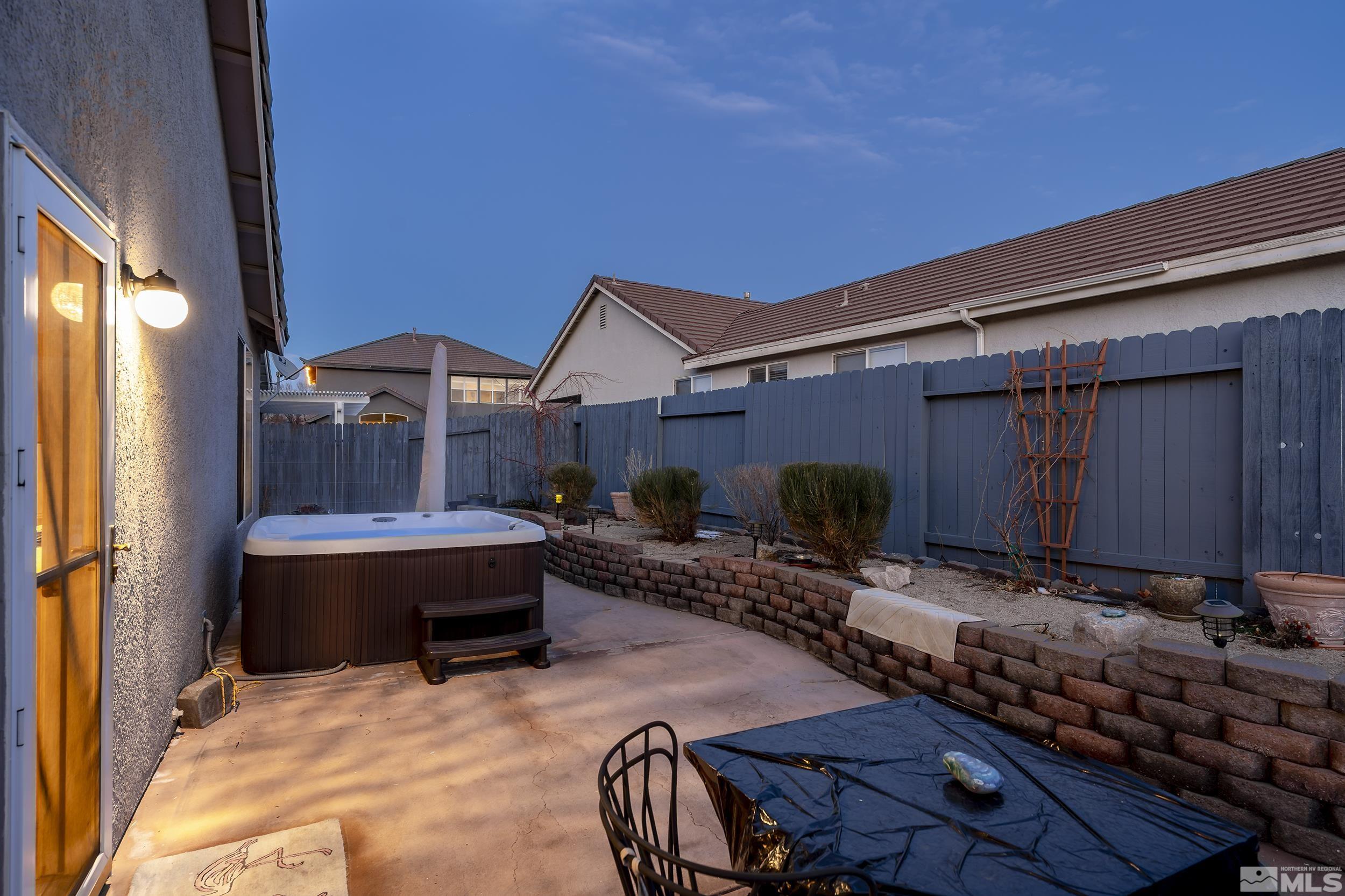 1474 Diamond Country Drive Reno, NV 89521 - Photo 6 of 38 a view of house with backyard and furniture