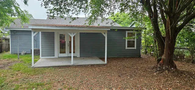 a view of a house with a tree