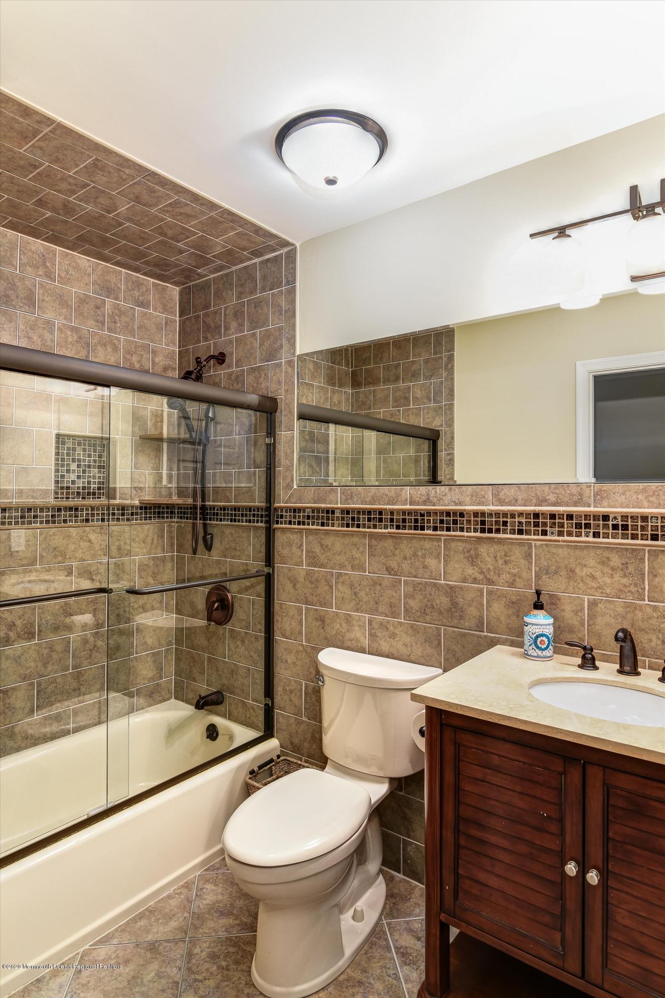 11 Sun Hollow Road Howell, NJ 07731 - Photo 17 of 27 a bathroom with a sink toilet and shower