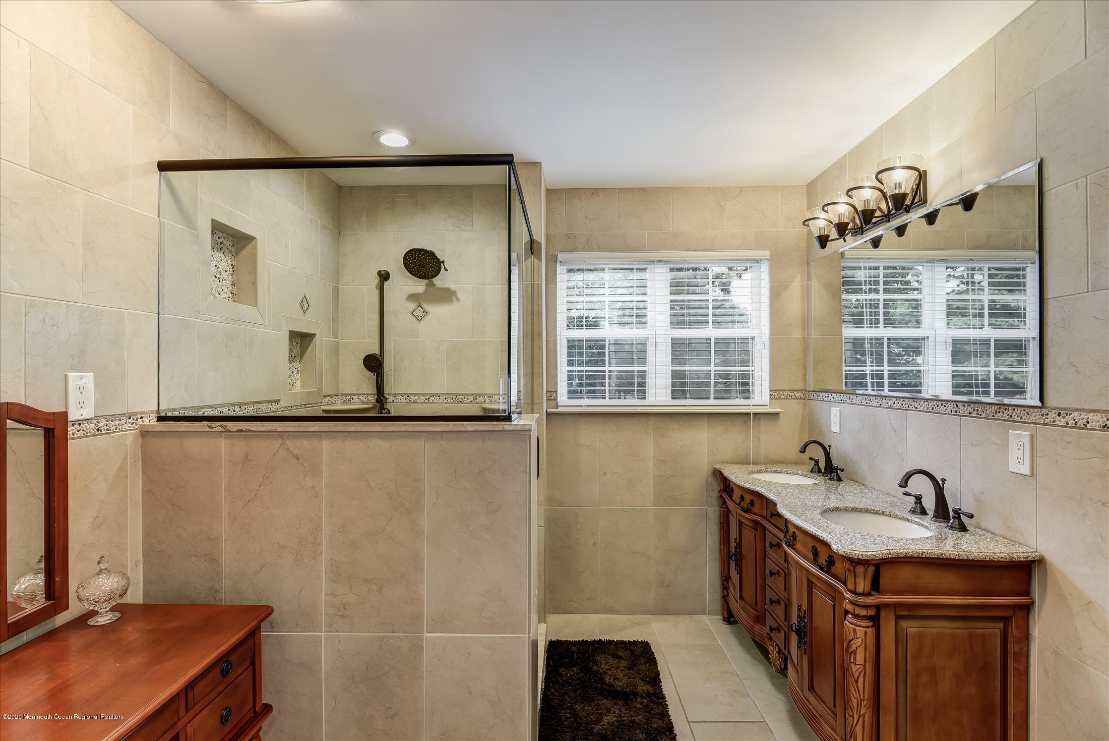 11 Sun Hollow Road Howell, NJ 07731 - Photo 19 of 27 a bathroom with a sink and a mirror