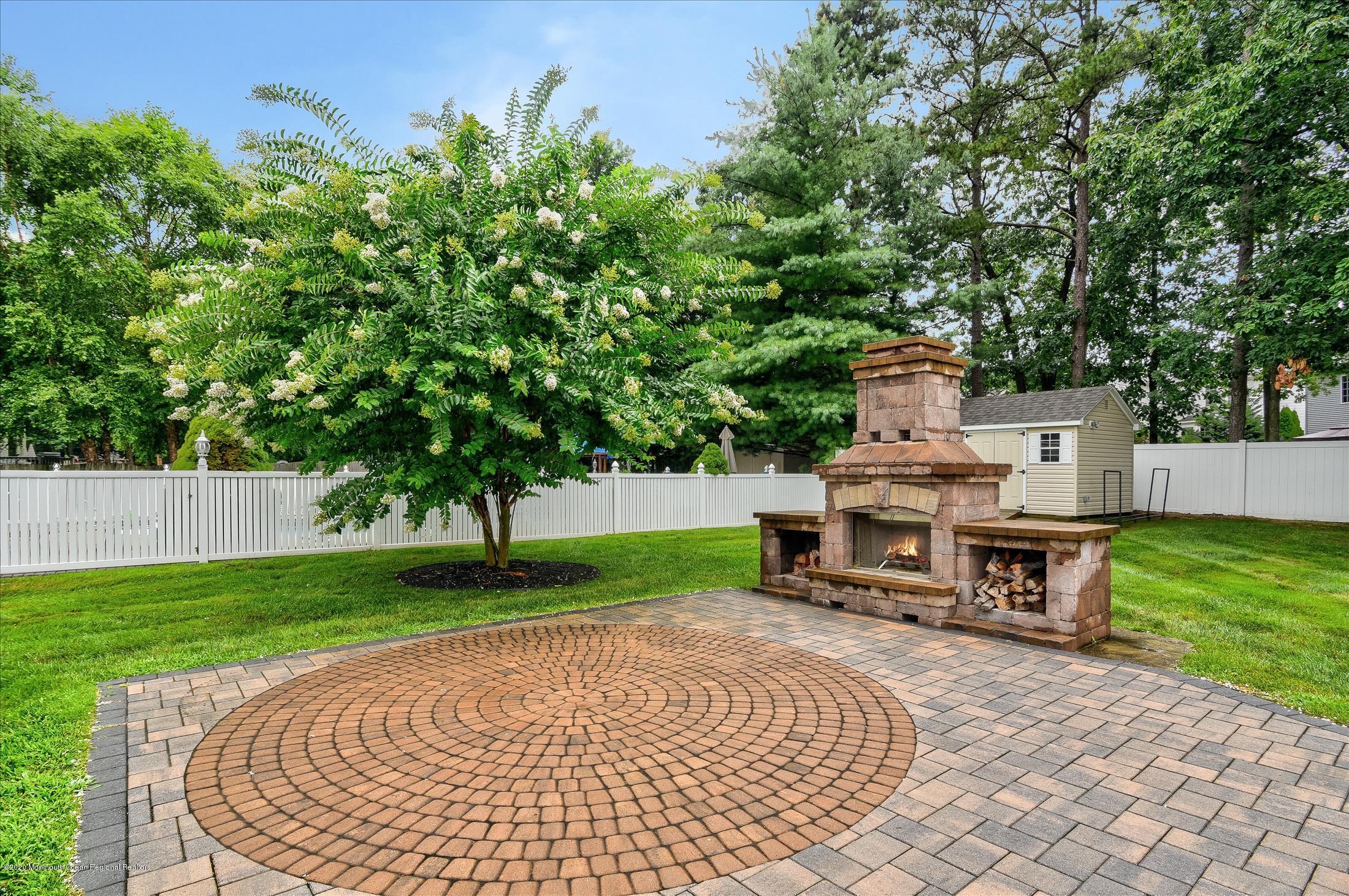 11 Sun Hollow Road Howell, NJ 07731 - Photo 25 of 27 a view of a backyard with sitting area
