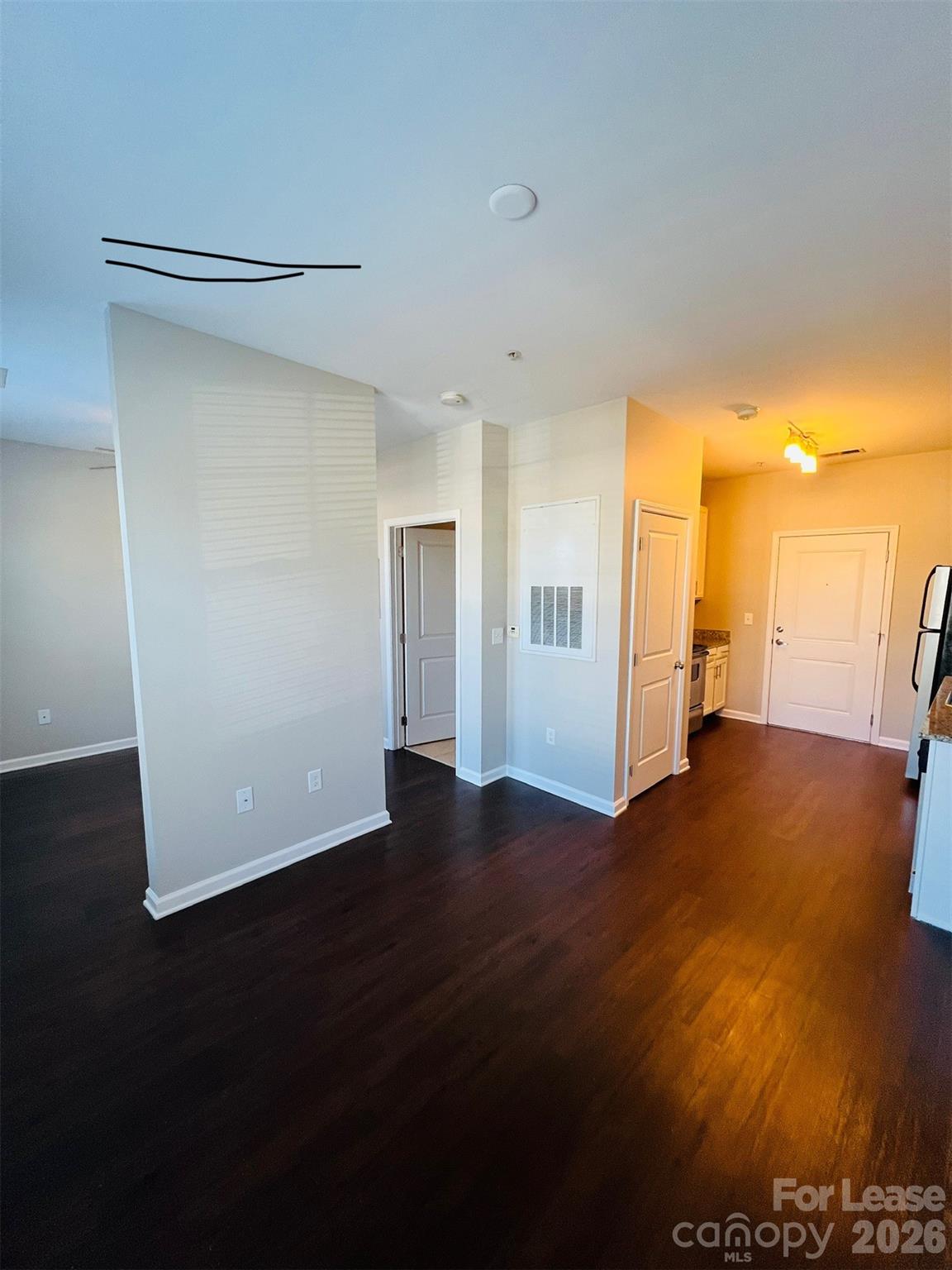 4310 Park Road, Unit 207 Charlotte, NC 28209 - Photo 2 of 9 a view of empty room with wooden floor
