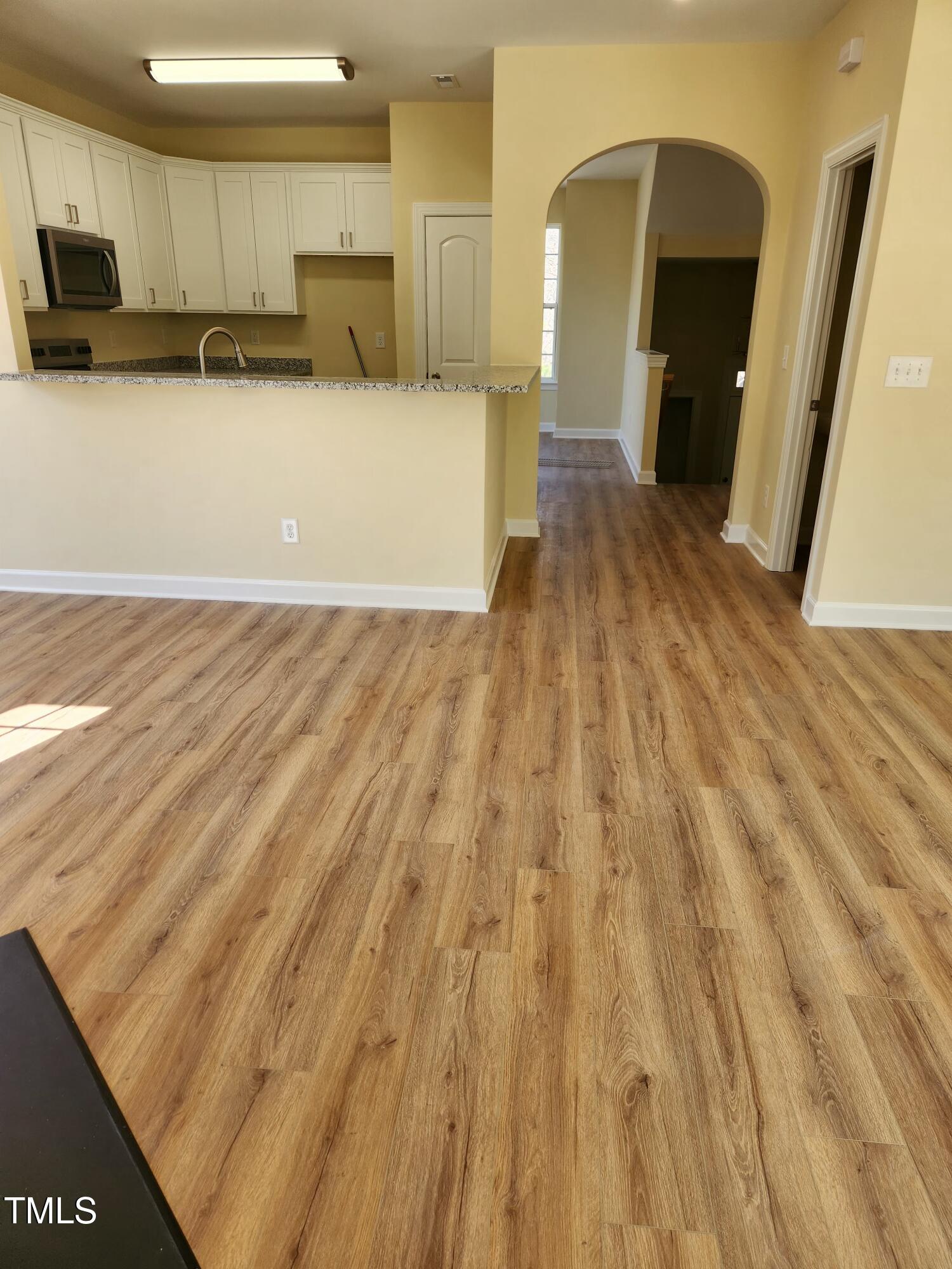 5409 Crescentview Parkway Raleigh, NC 27606 - Photo 9 of 46 Living room to kitchen