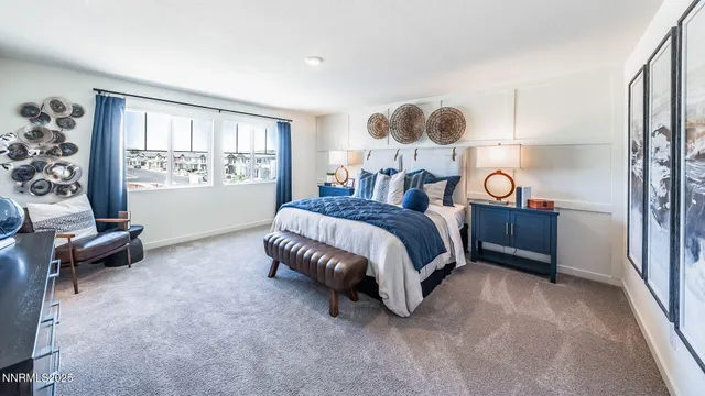 a spacious bedroom with a bed and window