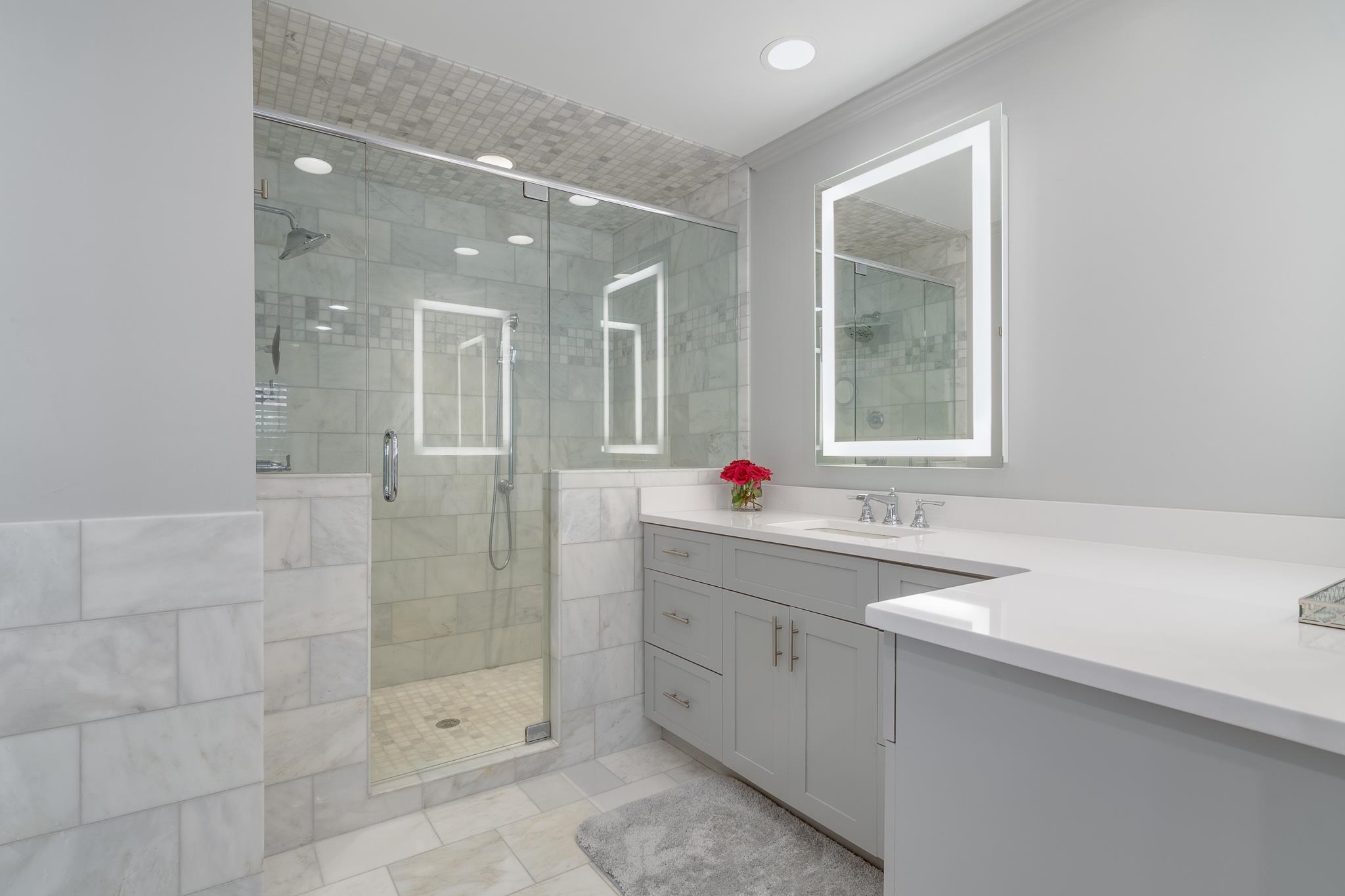 6417 Wood Bridge Road Memphis, TN 38119 - Photo 14 of 25 Beautiful marble floors & marble shower with glass enclosure, Silestone countertops, lighted mirrors. Hand held shower wand & wall shower head, tankless hot water heater, you may never want to leave.