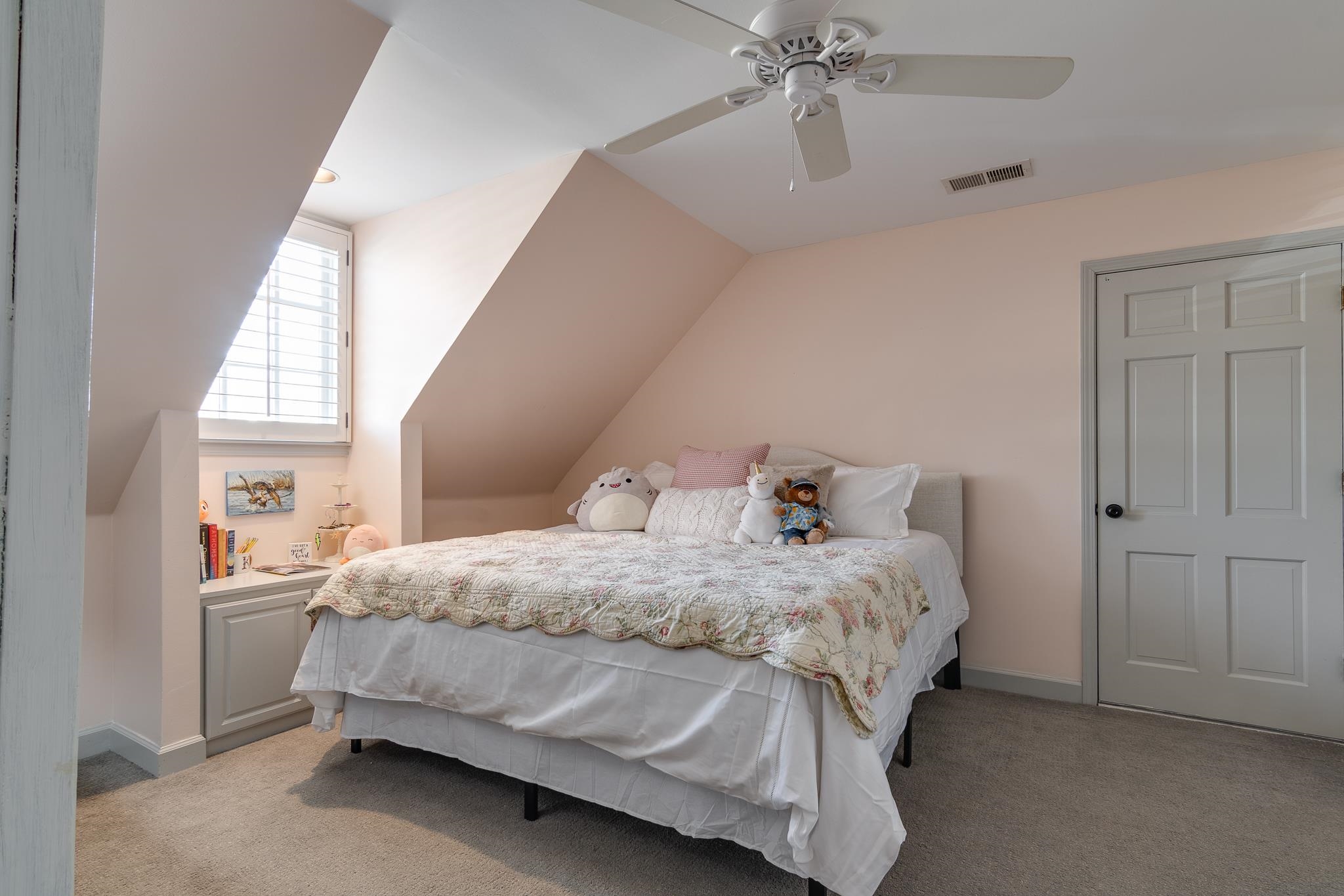 6417 Wood Bridge Road Memphis, TN 38119 - Photo 18 of 25 This carpeted bedroom has a double doored spacious closet with automatic lights. It also has a door to the large walk in attic with loads of space.