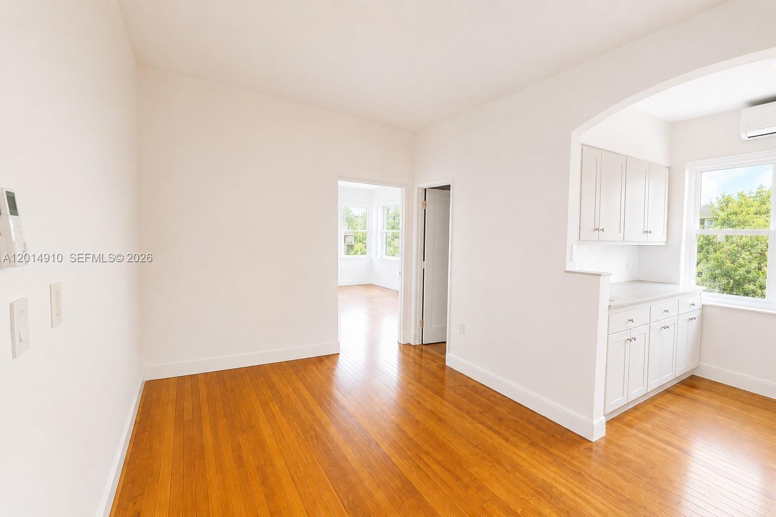 7936 Harding Avenue, Unit 1 Miami Beach, FL 33141 - Photo 5 of 7 a view of kitchen and wooden floor