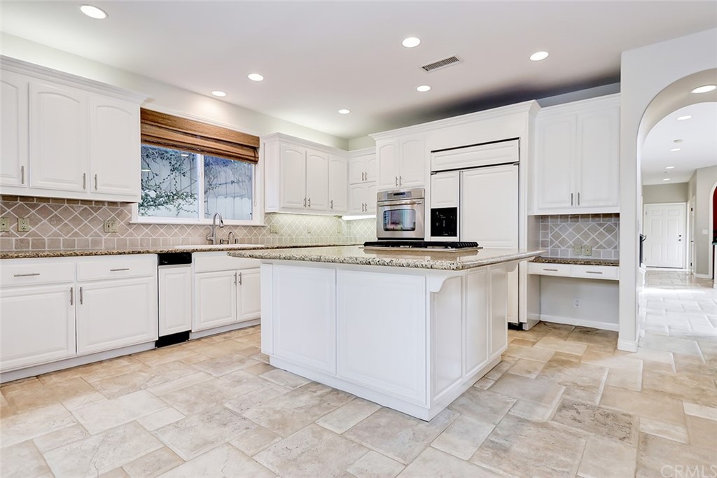 717 29th Street Manhattan Beach, CA 90266 - Photo 21 of 47 Kitchen island with breakfast bar and separate desk area