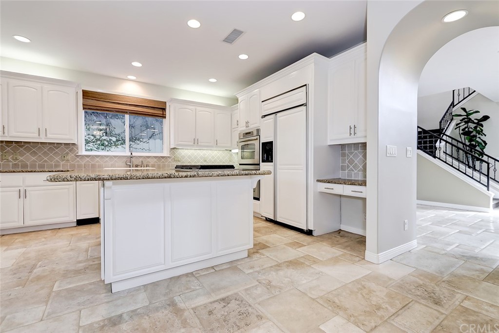 717 29th Street Manhattan Beach, CA 90266 - Photo 22 of 47 Granite countertops, stone floors, and recessed lighting
