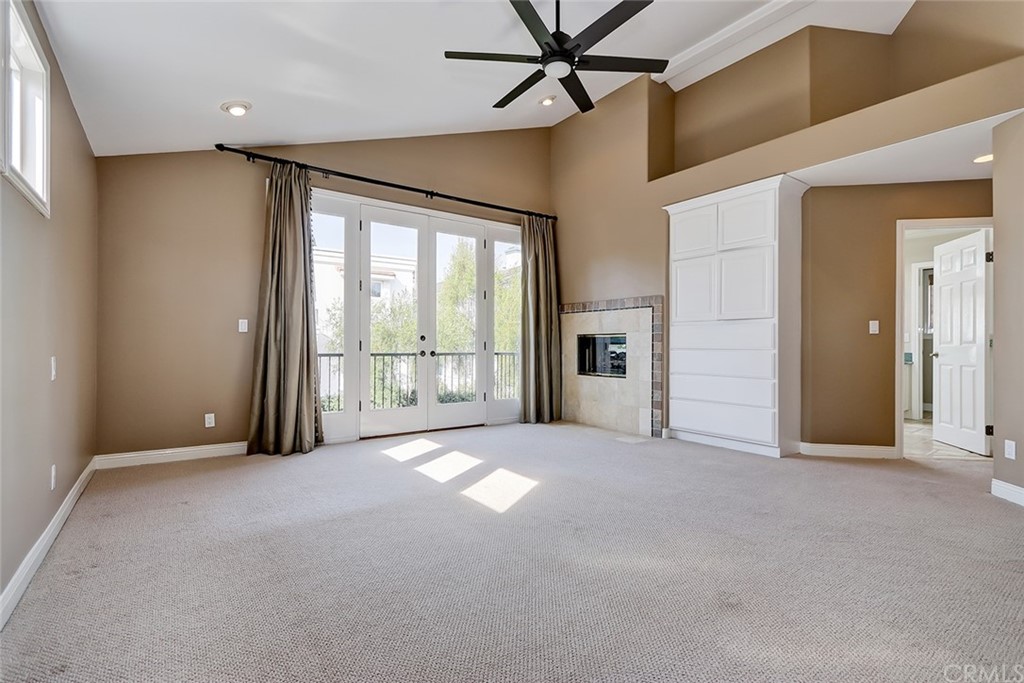 717 29th Street Manhattan Beach, CA 90266 - Photo 26 of 47 See through fireplace, vaulted ceilings, and built-in storage