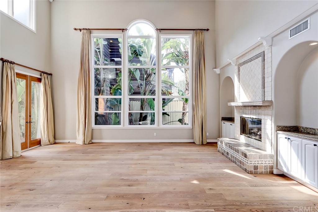 717 29th Street Manhattan Beach, CA 90266 - Photo 9 of 47 See through fireplace and French doors to entry way