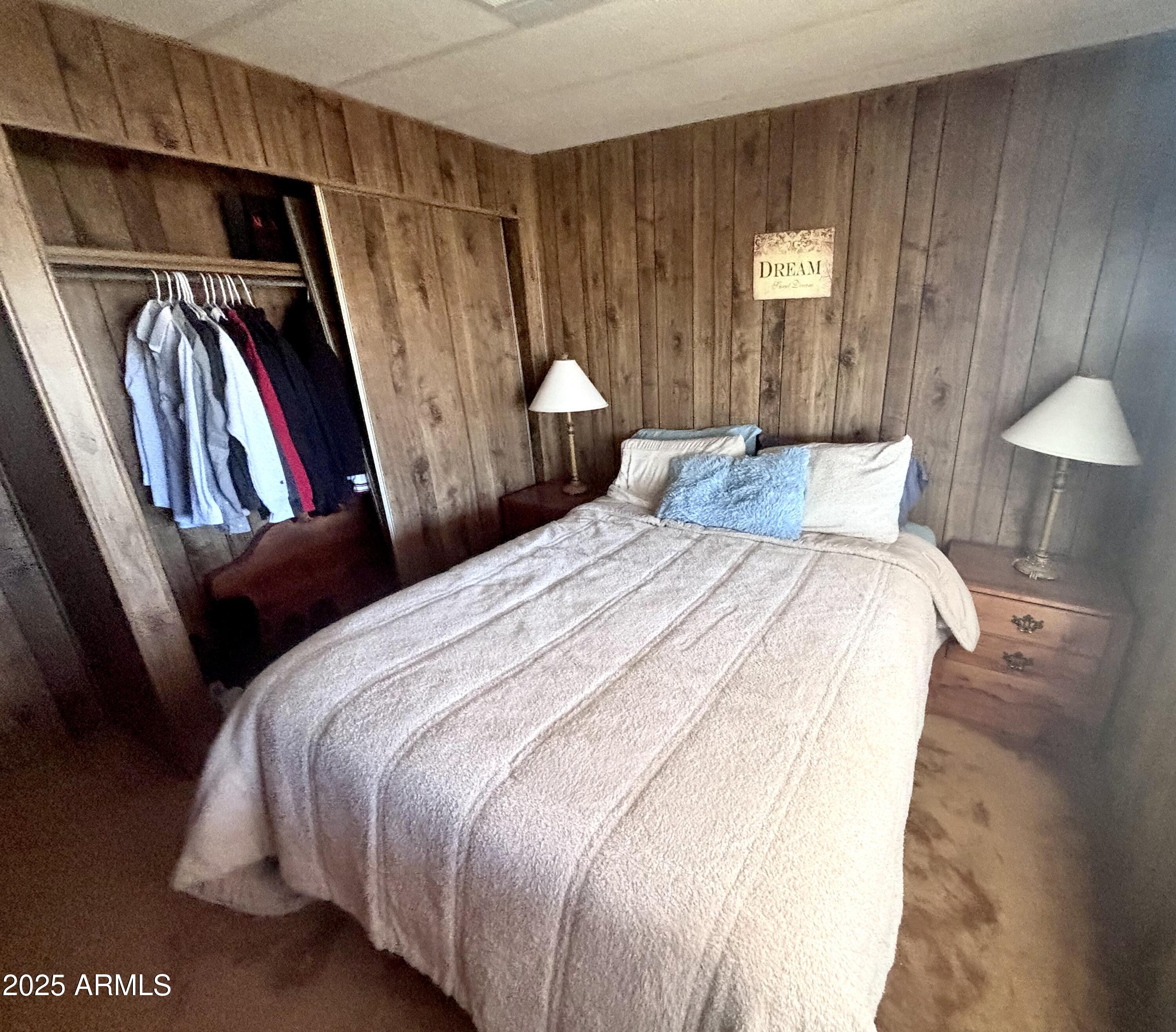 1221 West Nelson Road Ajo, AZ 85321 - Photo 14 of 17 a bedroom with a bed and a closet