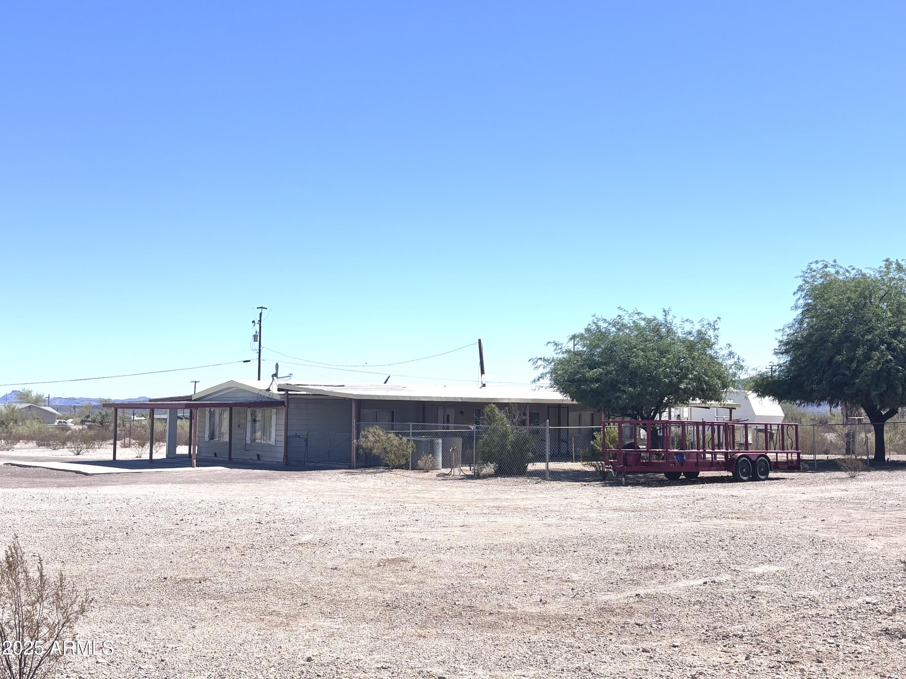 1221 West Nelson Road Ajo, AZ 85321 - Photo 3 of 17 a view of a house with a yard