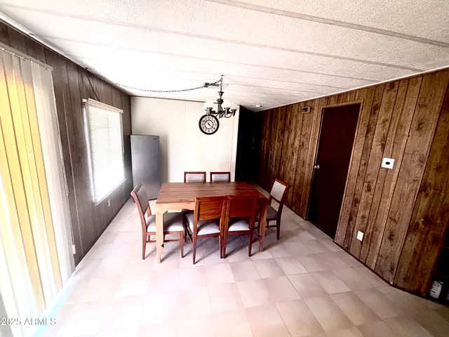 a view of a dining room with furniture and window