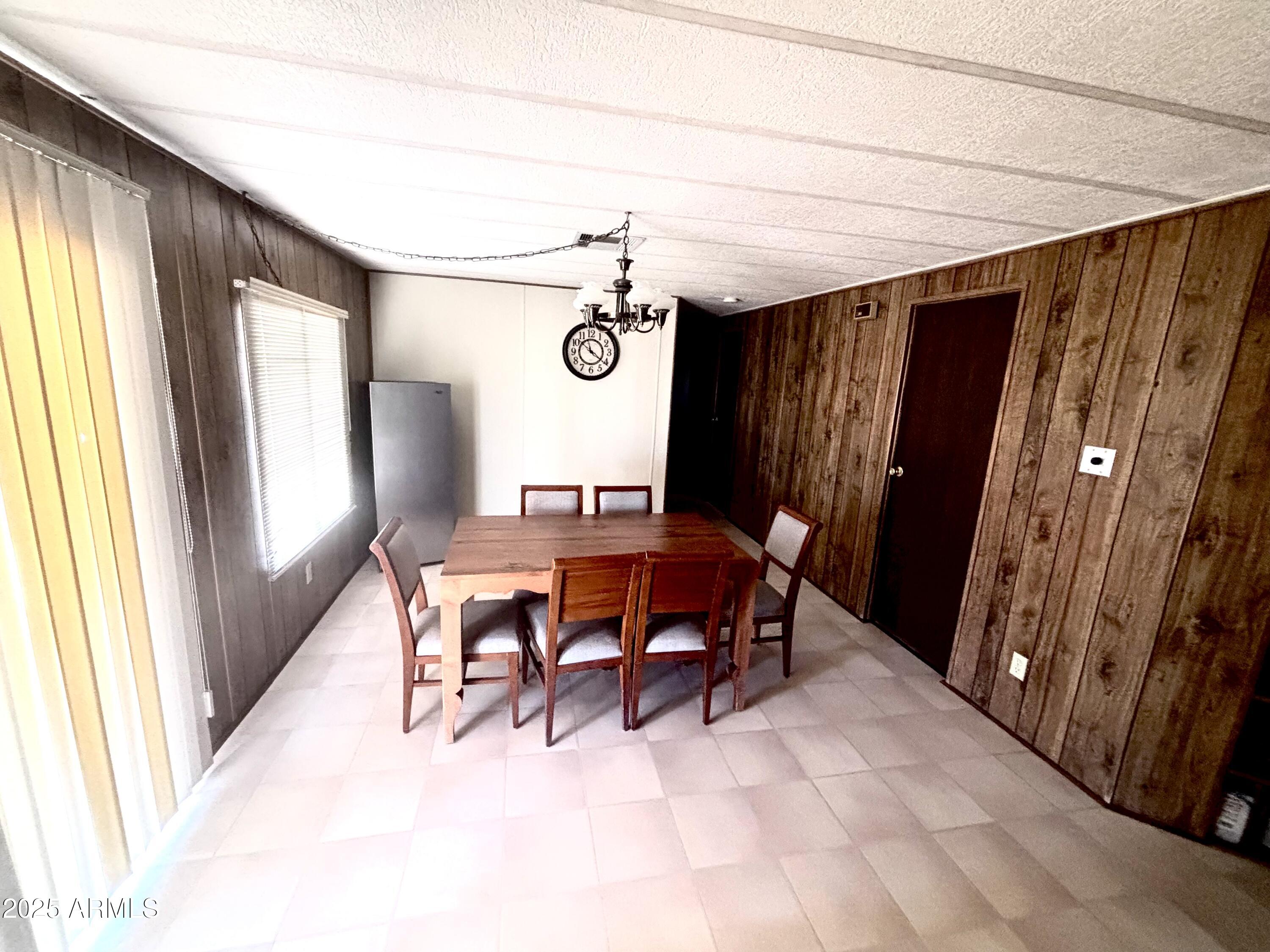 1221 West Nelson Road Ajo, AZ 85321 - Photo 9 of 17 a view of a dining room with furniture and window