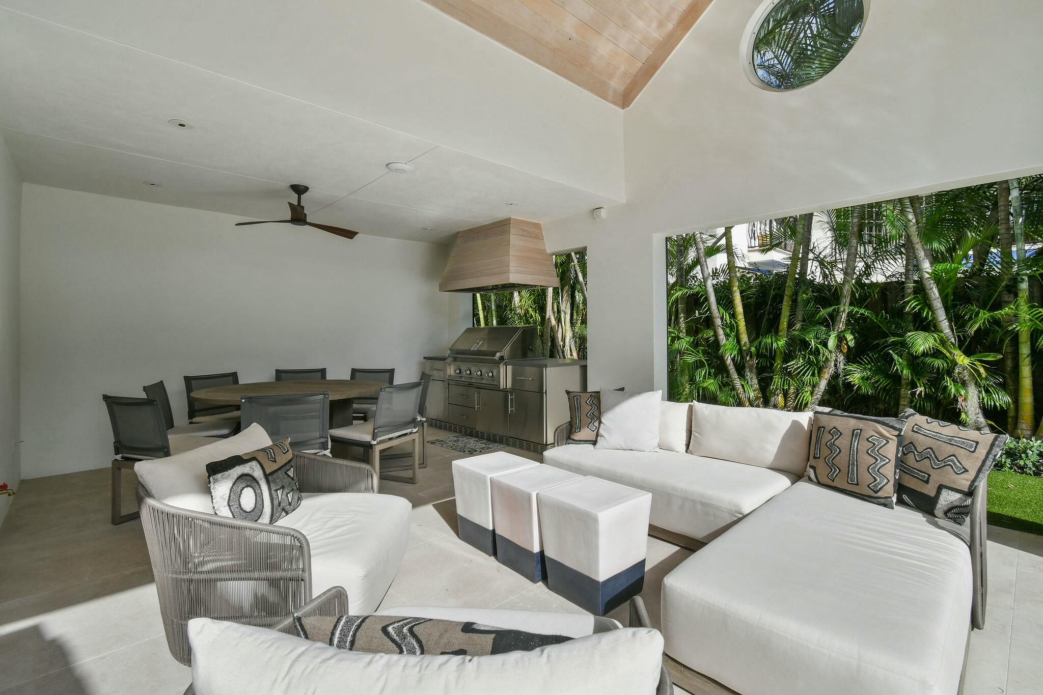 170 Beacon Lane Jupiter Inlet Colony, FL 33469 - Photo 26 of 46 a living room with furniture and a large window