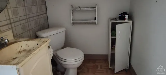 a bathroom with a toilet and a sink