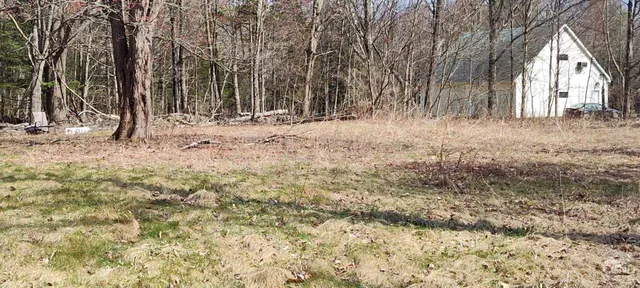 a view of wooden fence in a yard