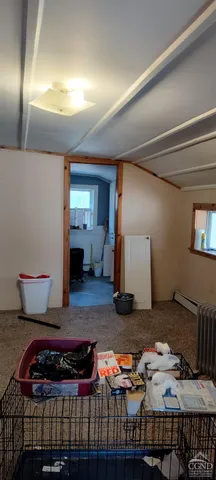 a bedroom with furniture and a lamp