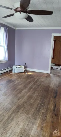 a view of room with window and hardwood