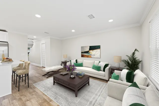 a living room with furniture and a table