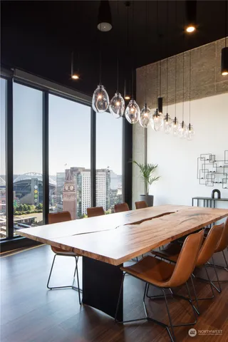 a living room with furniture a table and a large window