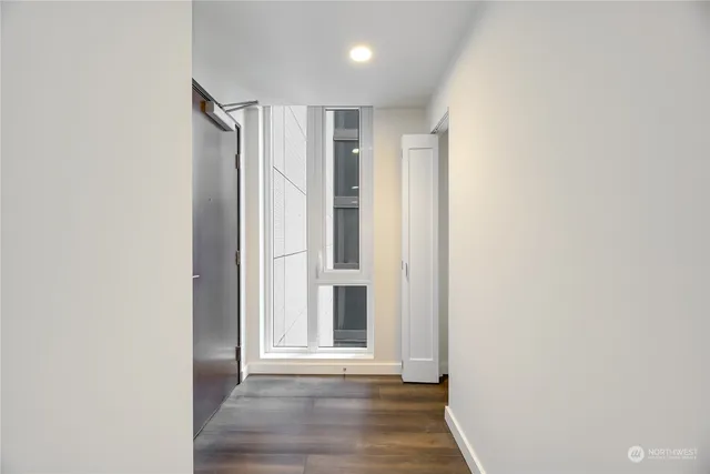 a view of entryway with wooden floor