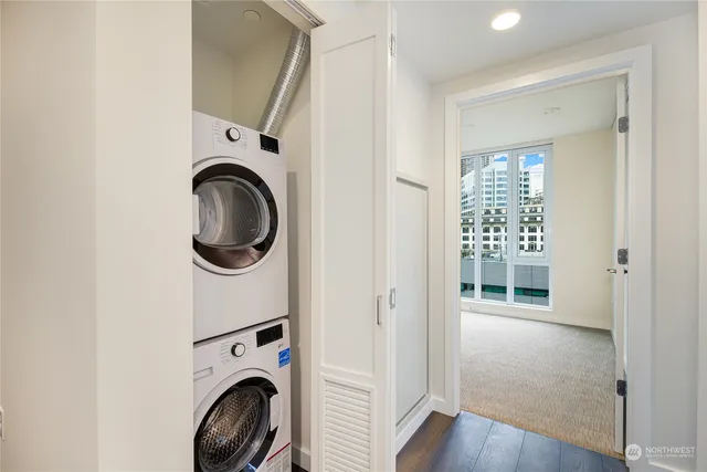 a view of a hallway with washer and dryer