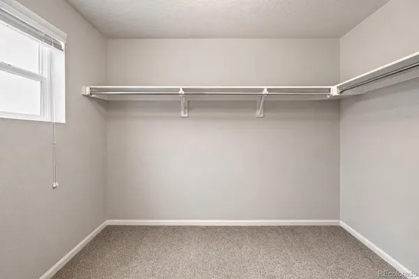 a view of an empty walk in closet