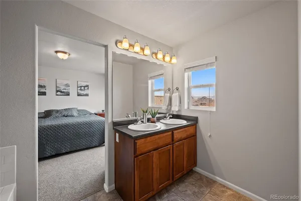 a en suite bathroom with a sink and a mirror