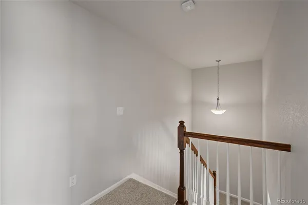 a view of hallway with stairs