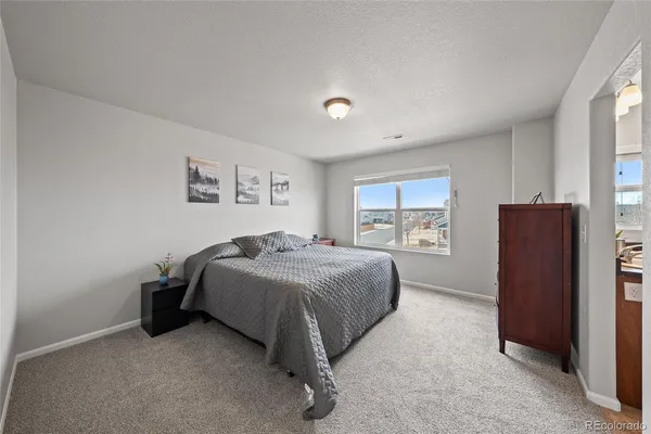 a bed room with a bed and a window