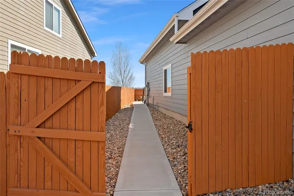 a view of a pathway with a backyard