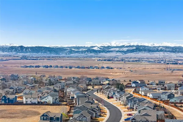 an aerial view of residential building and ocean view