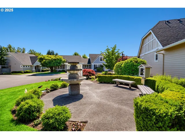 a view of a house with outdoor space and sitting area