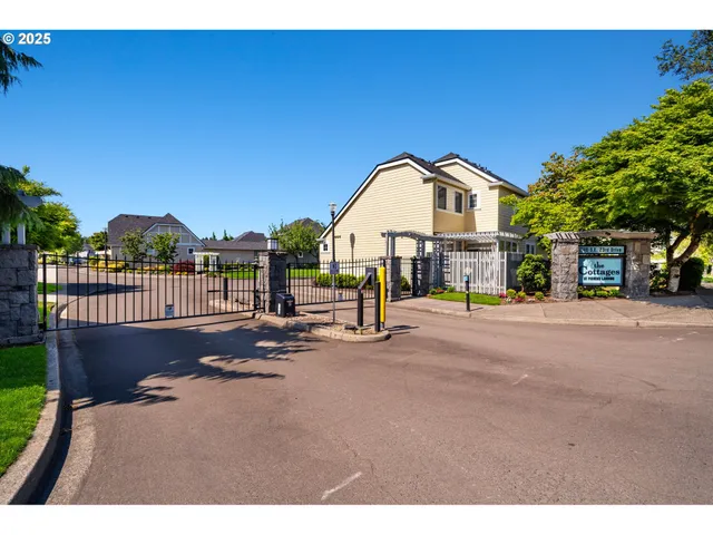 a view of a street with a bench in front of it