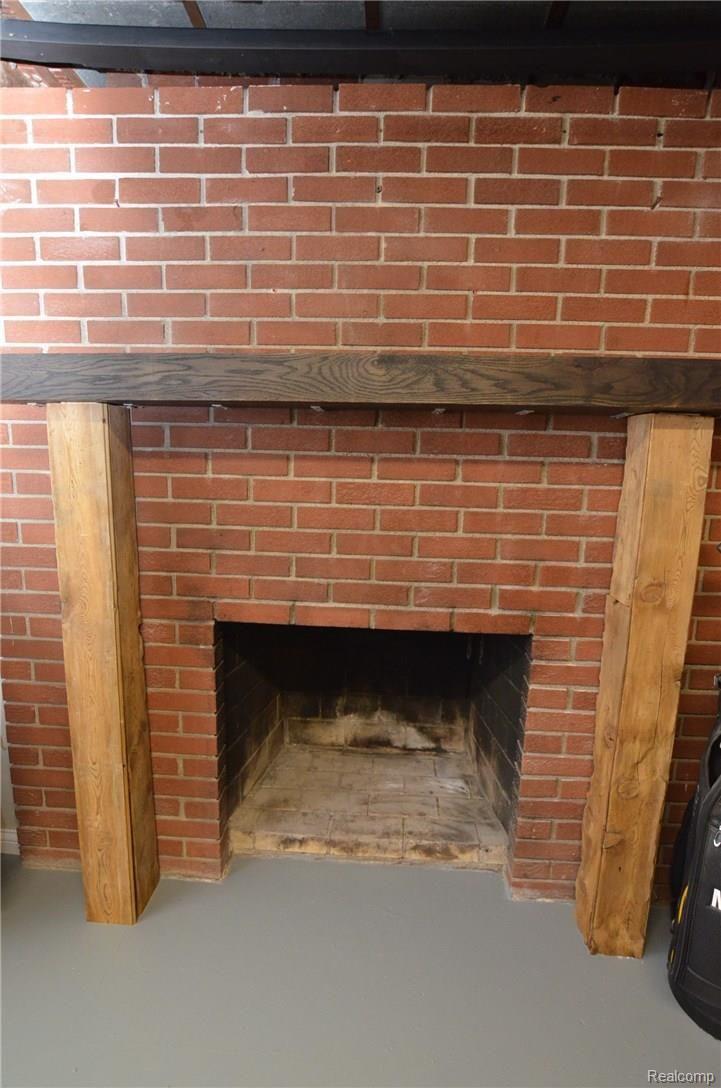 5770 Clarkston Road Clarkston, MI 48348 - Photo 22 of 28 LOWER LEVER NATURAL FIREPLACE